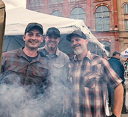 Chris Webb, Dan Casey and Tony Roberts at a BBQ event in Denver
